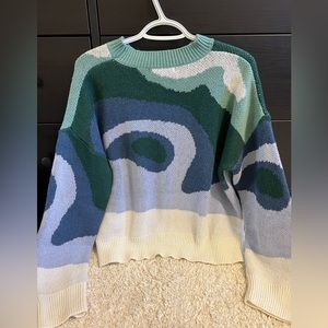 This cute and trendy sweater will make you all cozied up!